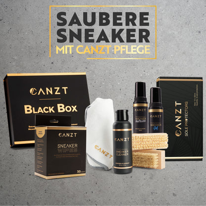 Canzt Black Box mit dem kompletten Inhalt vor grauem Hintergrund