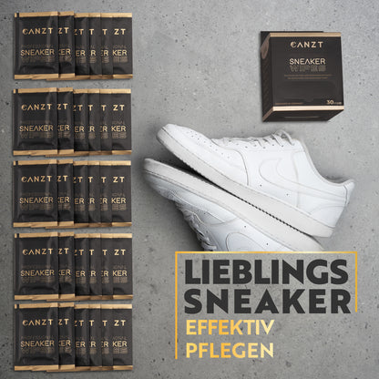Gestapelte Canzt Sneaker Wipes Boxen neben einem weißen Sneaker